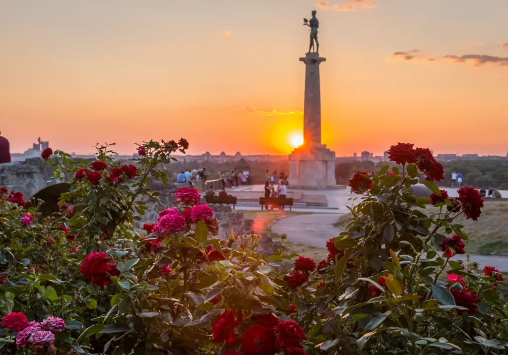 The Victor monument at Kalemegdan fortress above the rivers at sunset